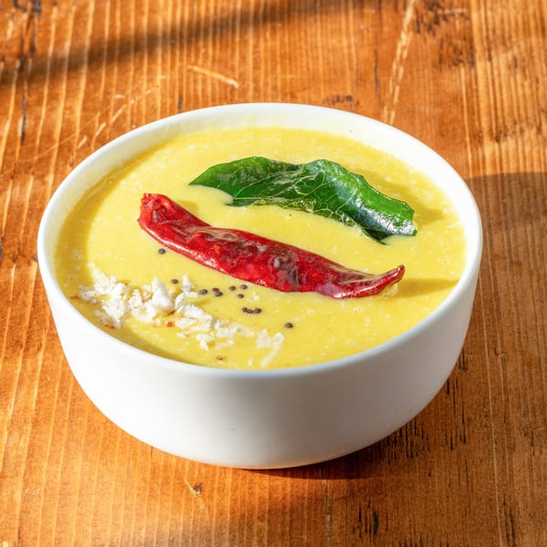 RaaSa Indian Cuisine's yellow curry with red chili, curry leaves, and shredded coconut.